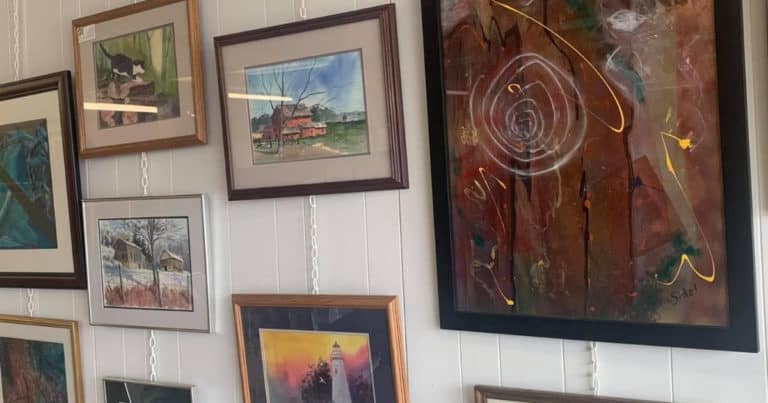 Tusc Art Co-op gallery wall with hanging art