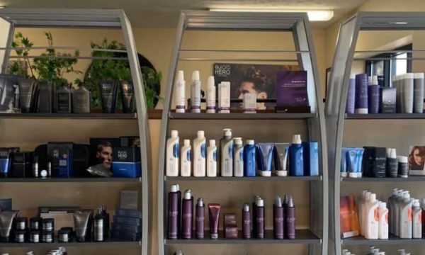 Wall with beauty products at New Angle salon and spa